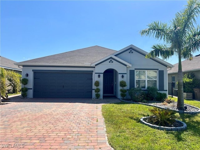 single story home with a garage and a front yard