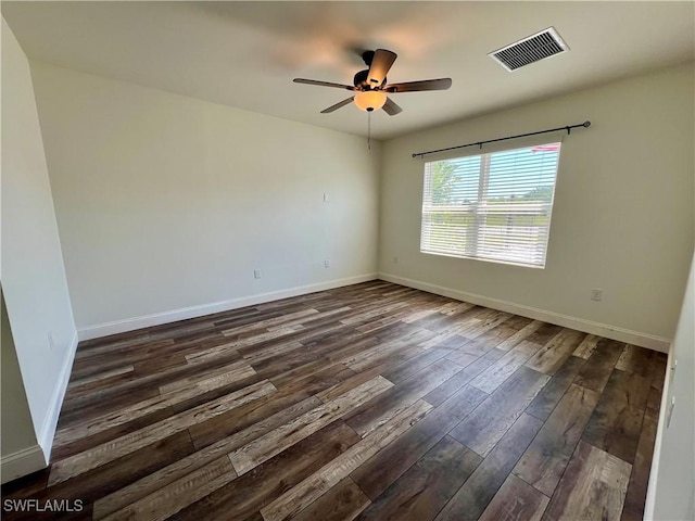 unfurnished room featuring ceiling fan and dark hardwood / wood-style floors