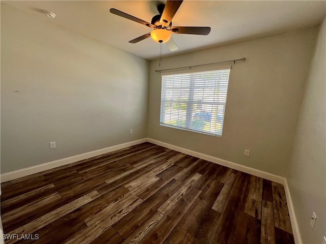 unfurnished room with ceiling fan and dark hardwood / wood-style flooring