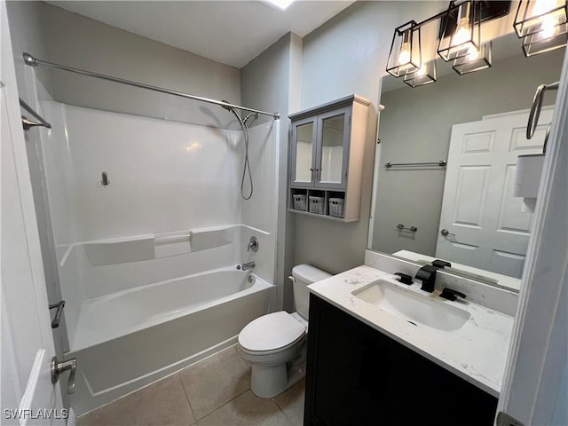 full bathroom with tile patterned flooring, vanity, bathing tub / shower combination, and toilet