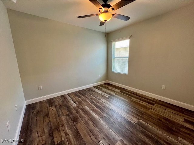 unfurnished room with ceiling fan and dark hardwood / wood-style floors