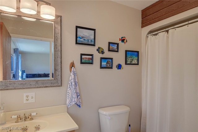 373 Hile Ln, Punta Gorda, FL 33982 - bathroom featuring toilet, vanity, and a shower with shower curtain