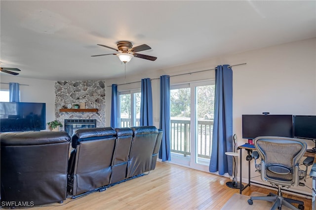 373 Hile Ln, Punta Gorda, FL 33982 - living area with ceiling fan, wood finished floors, an office area, and a fireplace