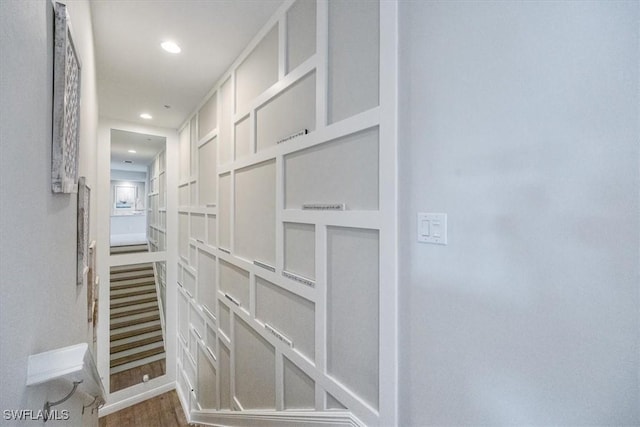 corridor featuring dark wood-style floors and recessed lighting