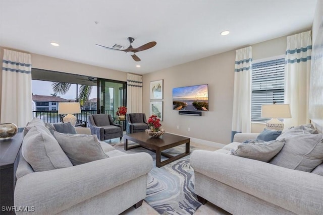 living area with visible vents, recessed lighting, a ceiling fan, and baseboards