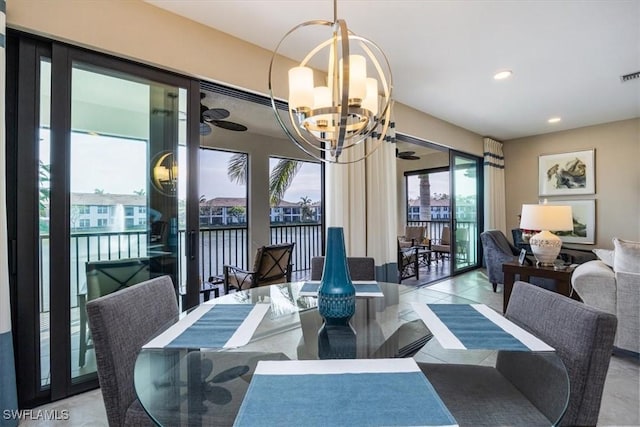 dining room featuring ceiling fan with notable chandelier, visible vents, and recessed lighting