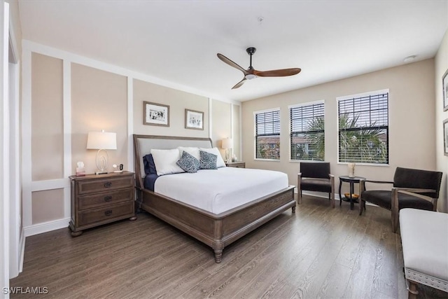 bedroom with dark wood-style floors and ceiling fan