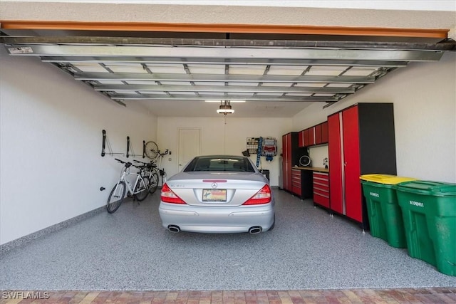 garage featuring baseboards and a garage door opener