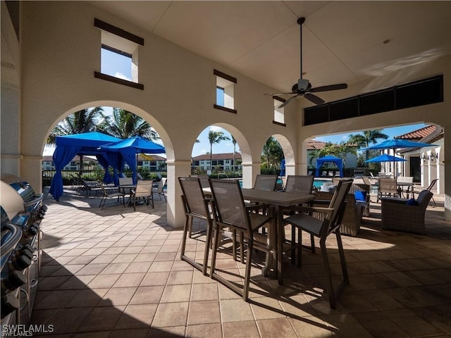 view of patio / terrace featuring outdoor dining area and ceiling fan