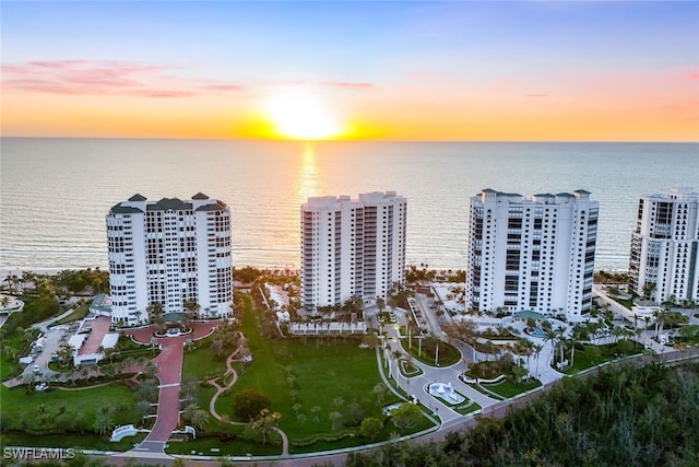 aerial view at dusk with a water view