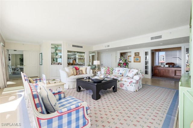 living room with ornamental molding