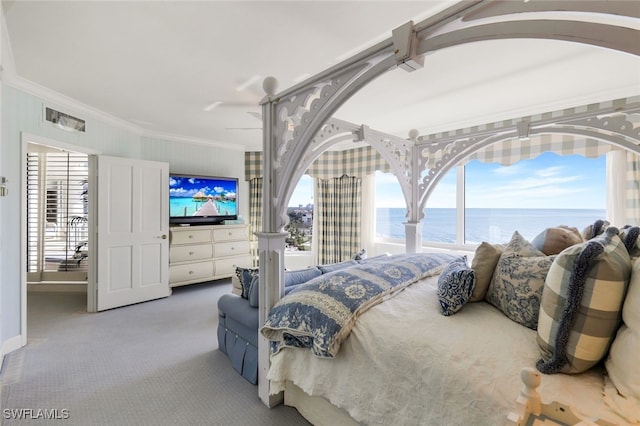 bedroom with multiple windows, carpet flooring, and ornamental molding