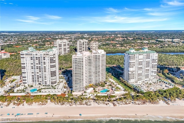 bird's eye view featuring a water view and a view of the beach