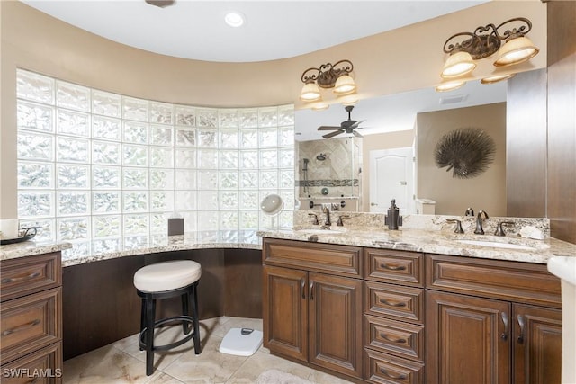 bathroom with vanity, walk in shower, ceiling fan, toilet, and tile patterned floors