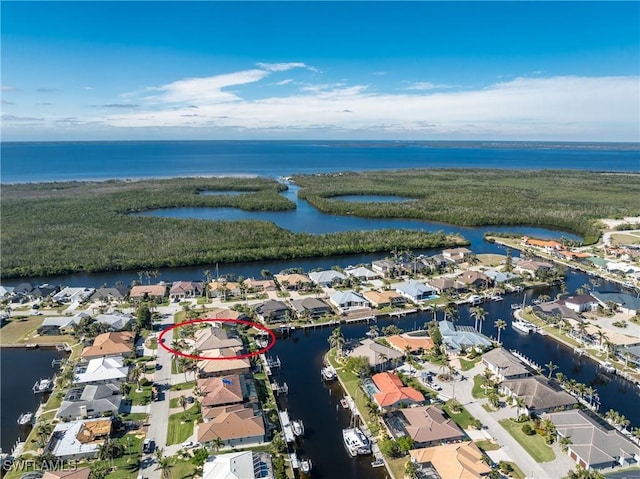 birds eye view of property featuring a water view