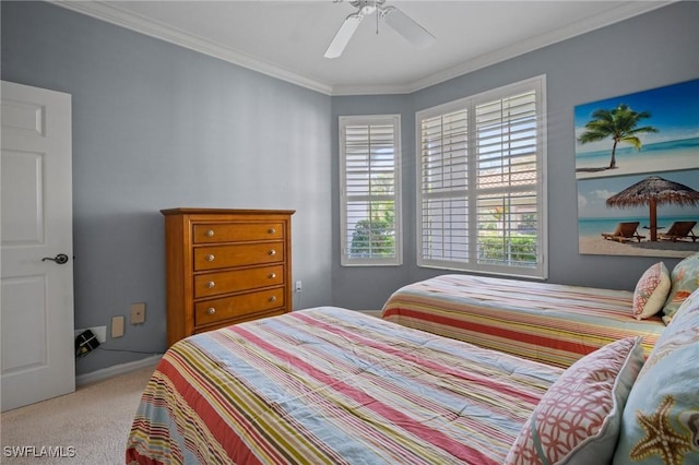 bedroom with ornamental molding, carpet flooring, and a ceiling fan