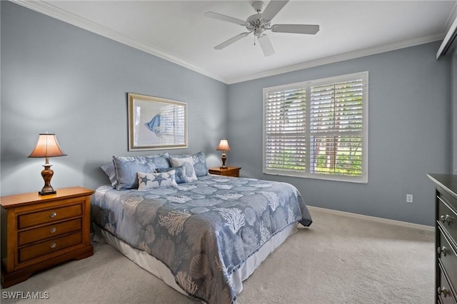 carpeted bedroom featuring a ceiling fan, crown molding, and baseboards
