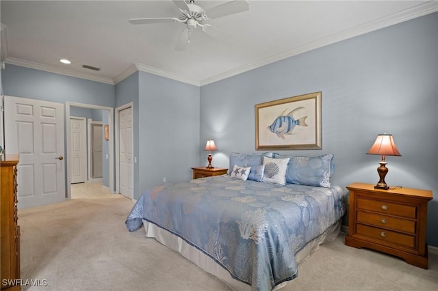 bedroom with visible vents, ceiling fan, crown molding, carpet flooring, and a closet