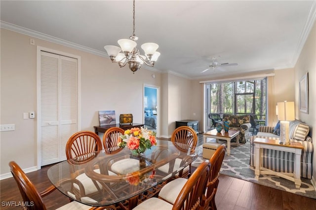 dining area featuring baseboards, ornamental molding, dark wood finished floors, and ceiling fan with notable chandelier