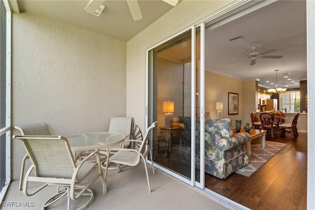 balcony featuring ceiling fan, outdoor dining area, and visible vents