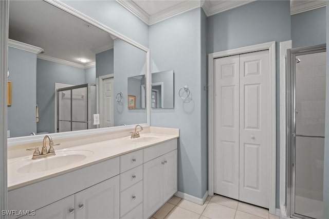 bathroom featuring tile patterned flooring, crown molding, and a sink