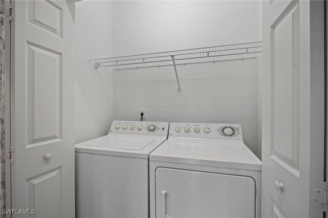 laundry area featuring laundry area and separate washer and dryer