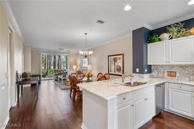 kitchen featuring dishwasher, a sink, visible vents, and dark wood-style floors