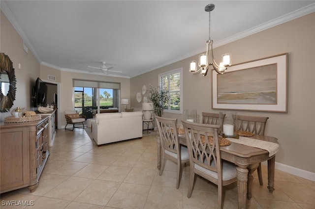 tiled dining area featuring ceiling fan with notable chandelier and crown molding