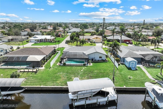 birds eye view of property featuring a residential view and a water view