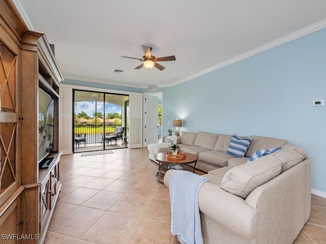 living area featuring light tile patterned floors, ornamental molding, and a ceiling fan