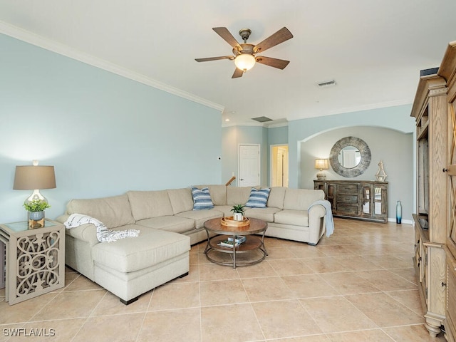 living area with ornamental molding, light tile patterned flooring, and visible vents