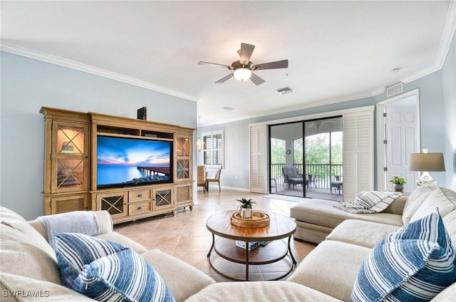 living room with visible vents, crown molding, and light tile patterned floors