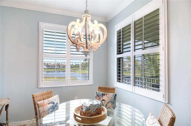 dining space featuring an inviting chandelier and ornamental molding