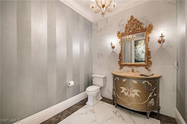 233 Mermaids Bight, Naples, FL 34103 - half bathroom with an inviting chandelier, vanity, toilet, marble finish floor, and ornamental molding