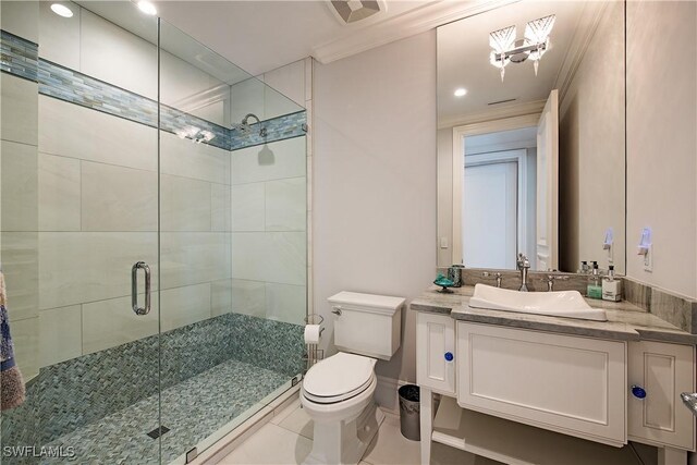 233 Mermaids Bight, Naples, FL 34103 - bathroom with a shower stall, tile patterned floors, toilet, crown molding, and visible vents