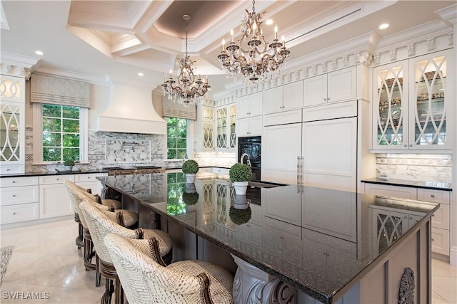 233 Mermaids Bight, Naples, FL 34103 - kitchen with custom exhaust hood, plenty of natural light, and ornamental molding