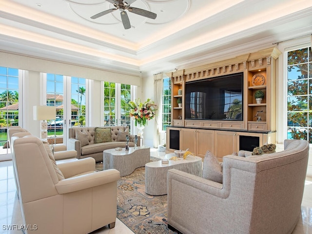 233 Mermaids Bight, Naples, FL 34103 - living area with a raised ceiling, a ceiling fan, and ornamental molding