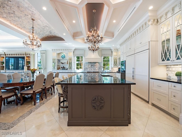 233 Mermaids Bight, Naples, FL 34103 - kitchen featuring a notable chandelier, glass insert cabinets, and crown molding