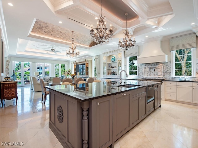 233 Mermaids Bight, Naples, FL 34103 - kitchen with a healthy amount of sunlight, ornamental molding, custom exhaust hood, and a sink