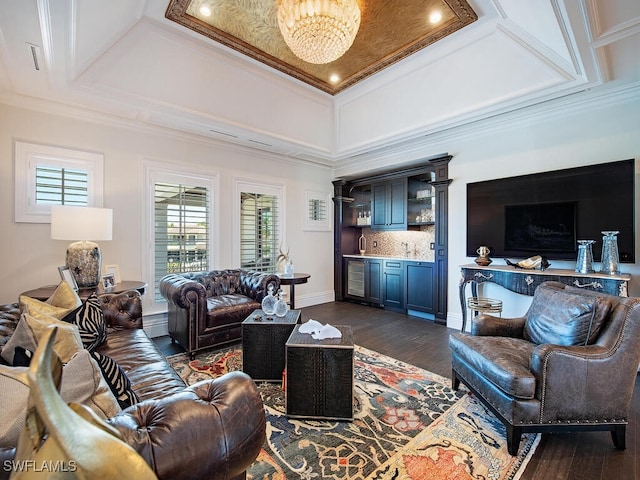 233 Mermaids Bight, Naples, FL 34103 - living room with a wealth of natural light, a notable chandelier, crown molding, and dark wood finished floors
