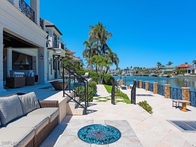 233 Mermaids Bight, Naples, FL 34103 - view of patio / terrace with a water view and outdoor lounge area
