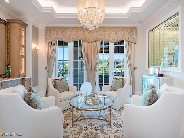 233 Mermaids Bight, Naples, FL 34103 - living room with crown molding, an inviting chandelier, and french doors