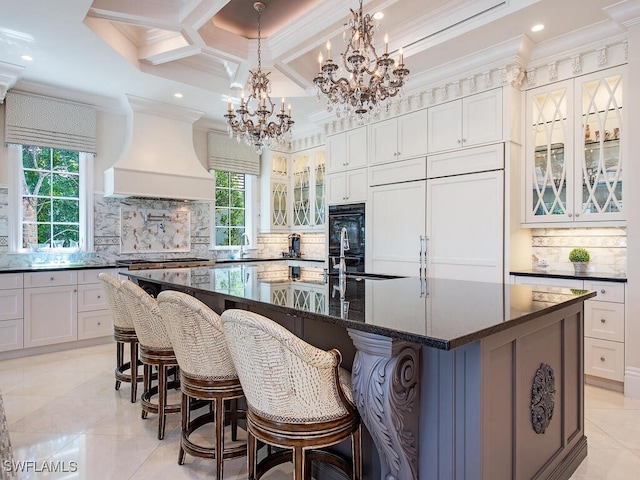 233 Mermaids Bight, Naples, FL 34103 - kitchen featuring backsplash, coffered ceiling, crown molding, and plenty of natural light