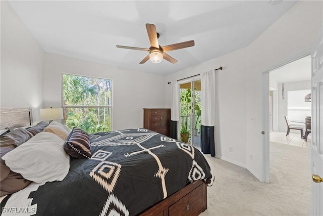 23039 Lone Oak Dr, Estero, FL 33928 - bedroom with access to exterior, baseboards, a ceiling fan, and light colored carpet