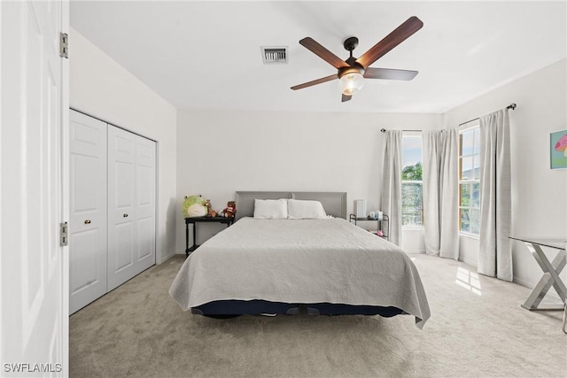 23039 Lone Oak Dr, Estero, FL 33928 - bedroom with ceiling fan, a closet, visible vents, and light colored carpet