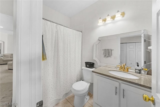 23039 Lone Oak Dr, Estero, FL 33928 - full bathroom with a closet, toilet, vanity, a shower with curtain, and tile patterned floors