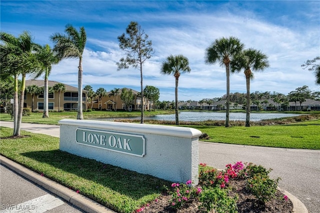 23039 Lone Oak Dr, Estero, FL 33928 - community sign with a water view, a residential view, and a lawn