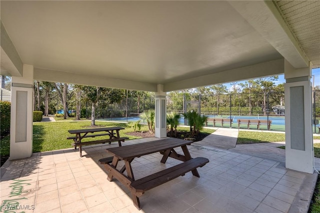 23039 Lone Oak Dr, Estero, FL 33928 - view of patio / terrace featuring a tennis court and fence