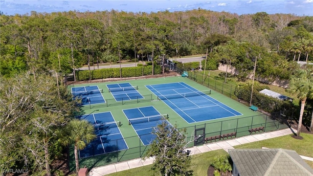 23039 Lone Oak Dr, Estero, FL 33928 - view of tennis court with fence and a view of trees