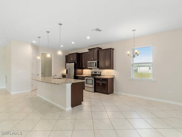 2911 SW 25th Pl, Cape Coral, FL 33914 - kitchen with stainless steel appliances, dark brown cabinets, a kitchen island with sink, baseboards, and recessed lighting